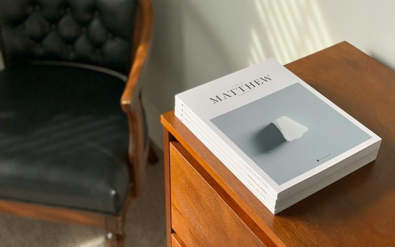 modern decor and a large book on a wooden table surface