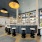 large bar with stools surrounding it