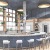 a room with a bar and chairs